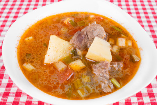 Goulash soup in a yellow bowl