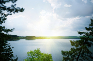 Fototapeta na wymiar Blue lake between the trees