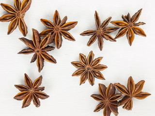 close up of star anise on a rustic white table