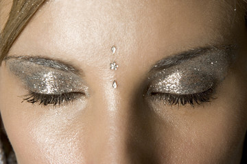 Naklejka premium Close up studio shot of women's eyes with luxury winter make up
