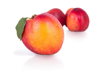 ripe nectarines on a white background