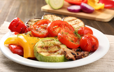 Delicious grilled vegetables on plate on table close-up