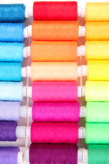 Multicolor sewing threads background