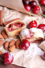 Tasty homemade strudel and fresh sweet cherry