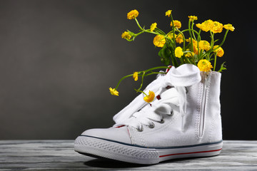 Beautiful gumshoes with flowers inside, isolated on white