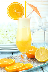 Delicious fruit smoothie on wooden table, close up
