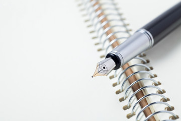 fountain pen on notebook