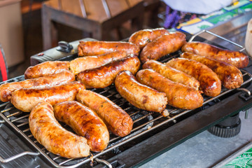 Grilled spicy sausages on the stove