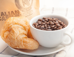 coffee and croissants on white blackground