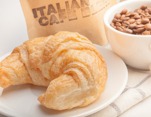 coffee and croissants on white blackground