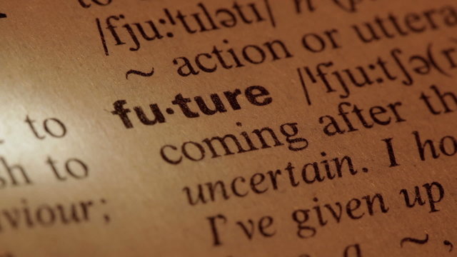 Word Future in a dictionary. Lit with a spotlight. Three similar