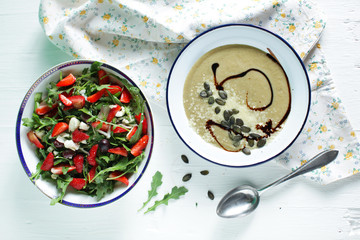 Arugula salad with strawberries and eggplant creamy soup - 65885724
