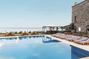 Swimming pool with stair at hotel close up