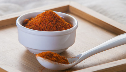 paprika spice on wooden background