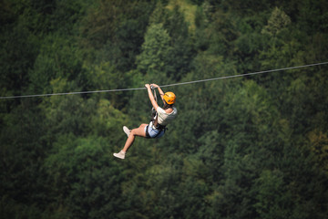 Adult woman on zip line © zorandim75