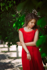 Portrait of a beautiful sexy fashion girl in a red dress 