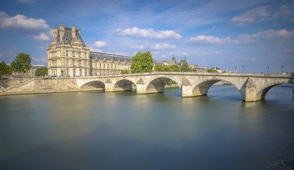 Fototapeta premium Long exposure view of Pont Royal and Louvre museum