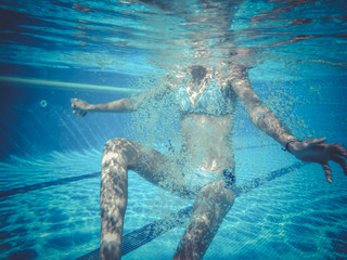 teenager diving into a pool
