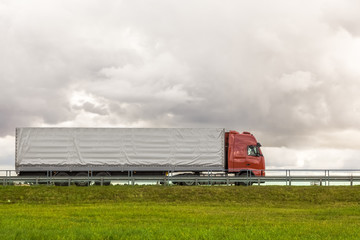 Obraz premium Trucks delivery cargoes