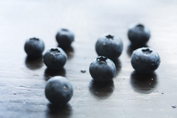 Fresh ripe blueberries on wooden table
