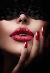 Beautiful Woman with Black Lace Mask over her Eyes