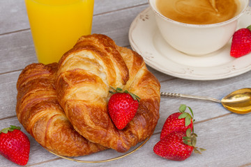 breakfast with croissants and fresh berries