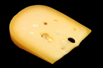 Piece of Cheese on Black Background