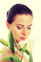 Fototapeta premium Beautiful woman with white lily.