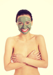 Beautifu toplessl woman with facial mask.