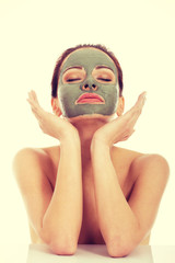 Beautifu toplessl woman with facial mask.