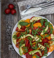 Salad of grilled avocado and multicolored tomatoes