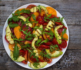 Salad of grilled avocado and multicolored tomatoes