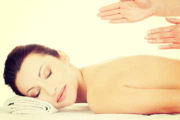 Obraz na płótnie Canvas Preaty woman relaxing beeing massaged in spa