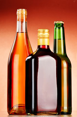 Bottles of assorted alcoholic beverages including beer and wine