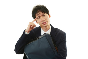 頭痛を訴えるビジネスマン