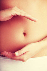 Fit and slim young woman belly