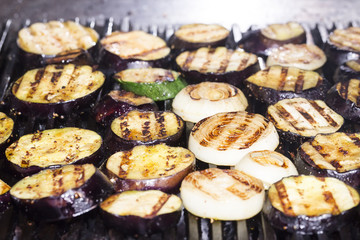 cooking vegetables on the grill in the kitchen at the restaurant