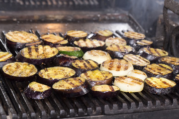 cooking vegetables on the grill in the kitchen at the restaurant