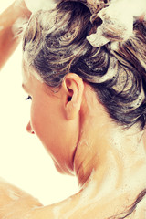 Naklejka premium Beautiful woman taking a shower