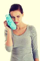 Young casual woman having a toothache.