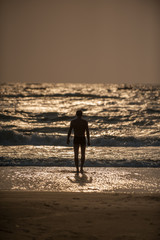 Fototapeta na wymiar young man on the beach
