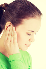 Fototapeta premium Young woman feeling a pain in ear