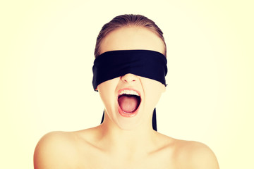 Blindfold woman screaming