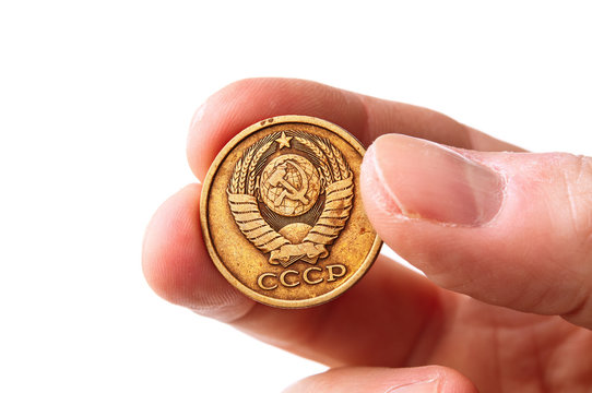 Old soviet copecks coin in hand