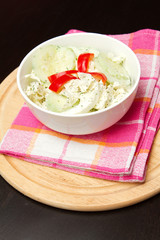 a fresh cucumber salad in a bowl