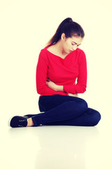 Obraz premium Young woman with stomach issues