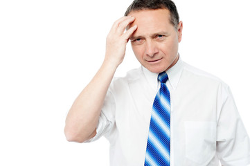 Businessman holding his head