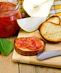 Bread with pear jam and leaf on board