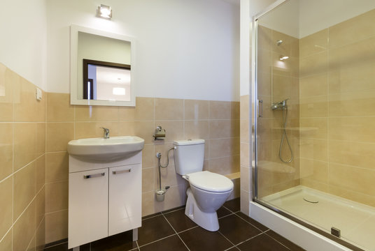 Modern bathroom with sinks, toilet