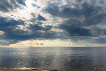 Fototapeta premium blue rain clouds over a calm sea
